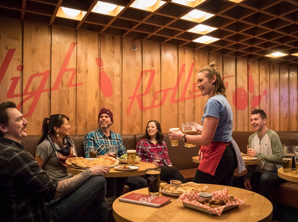 A group of people ordering food and bowling in Banff National Park