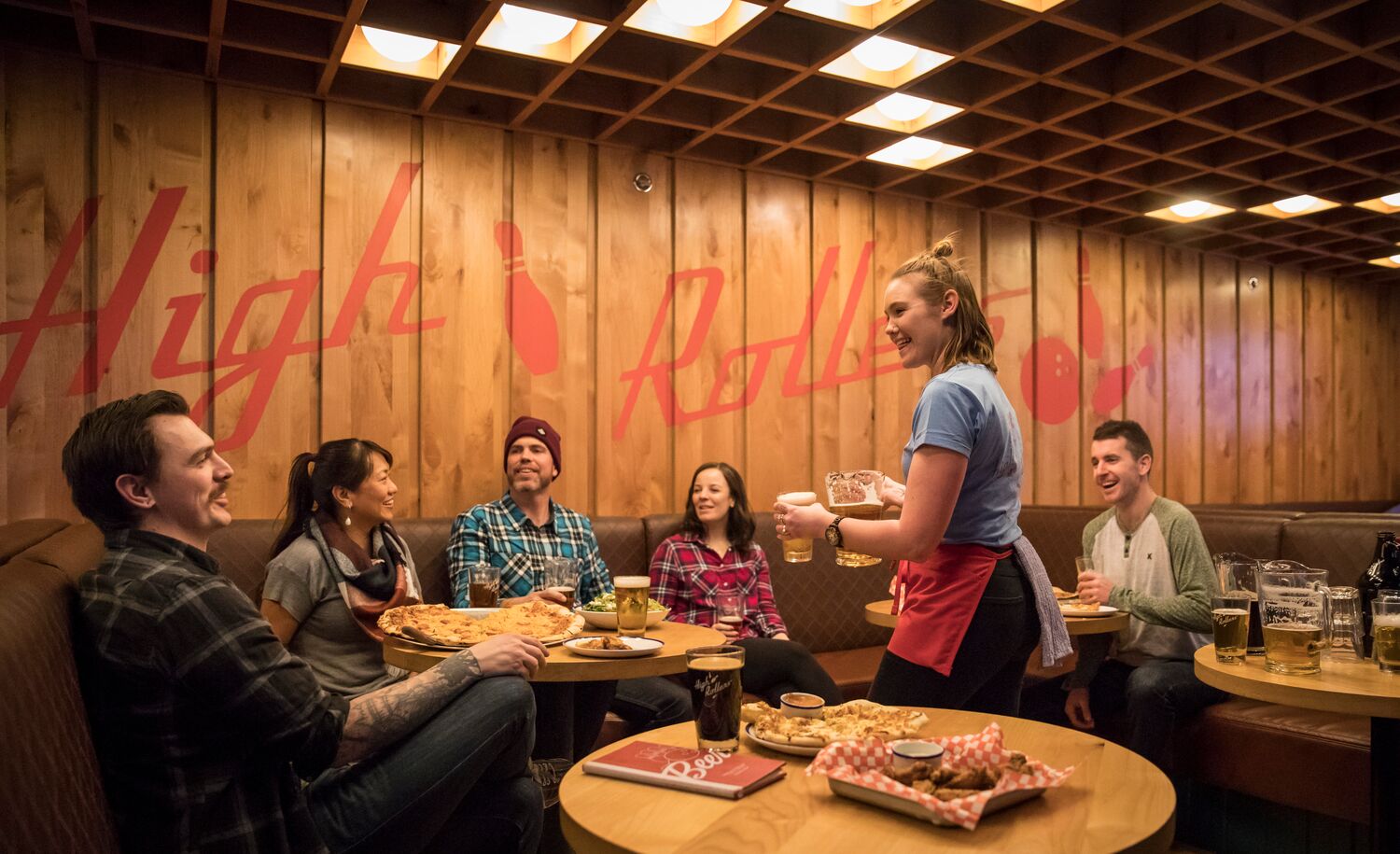 A group of people ordering food and bowling in Banff National Park