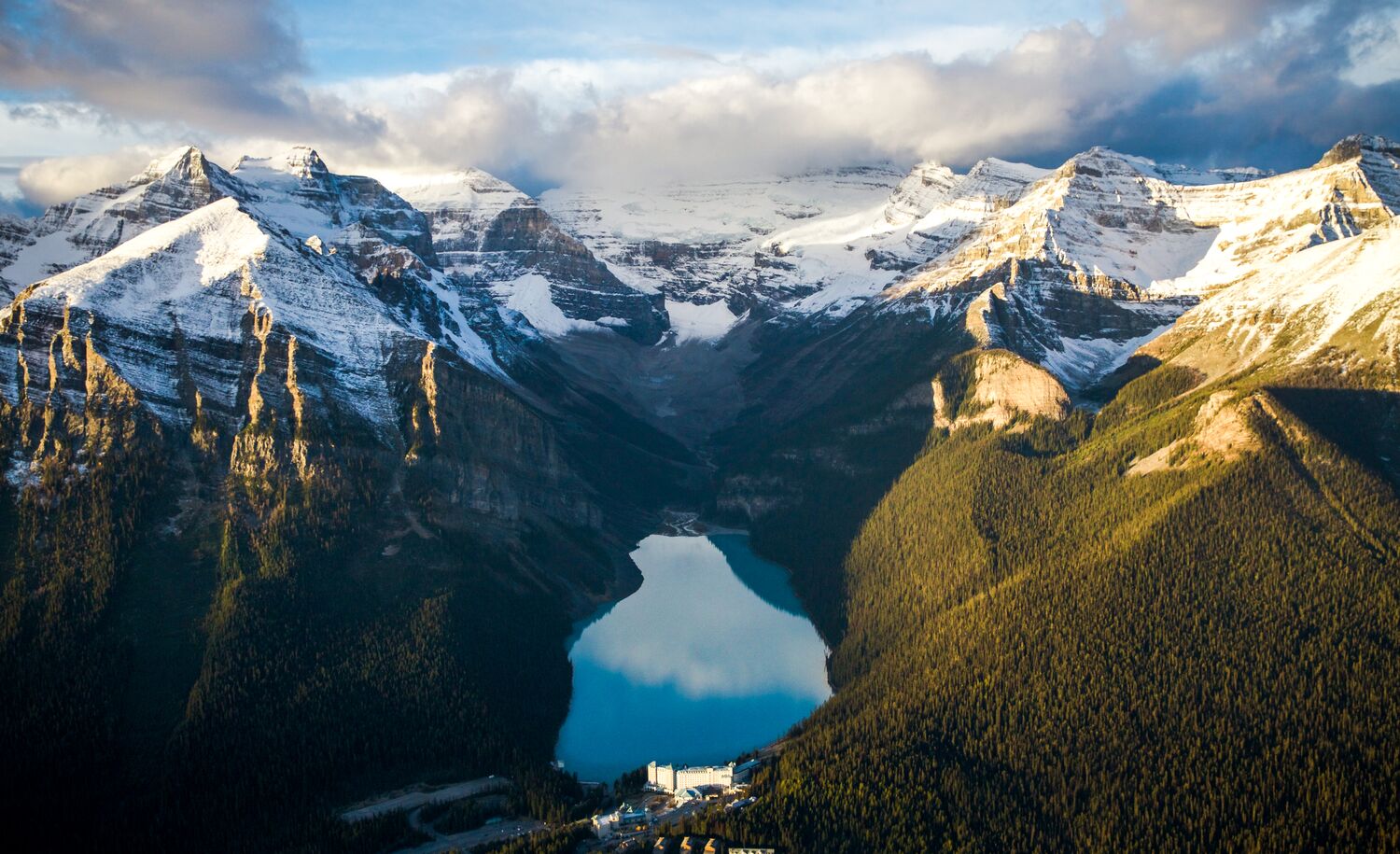 An aerial view of Lake Louise in Banff National Park at sunrise.