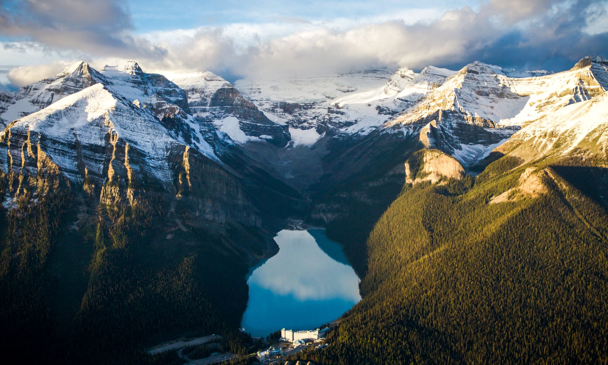 An aerial view of Lake Louise in Banff National Park at sunrise.