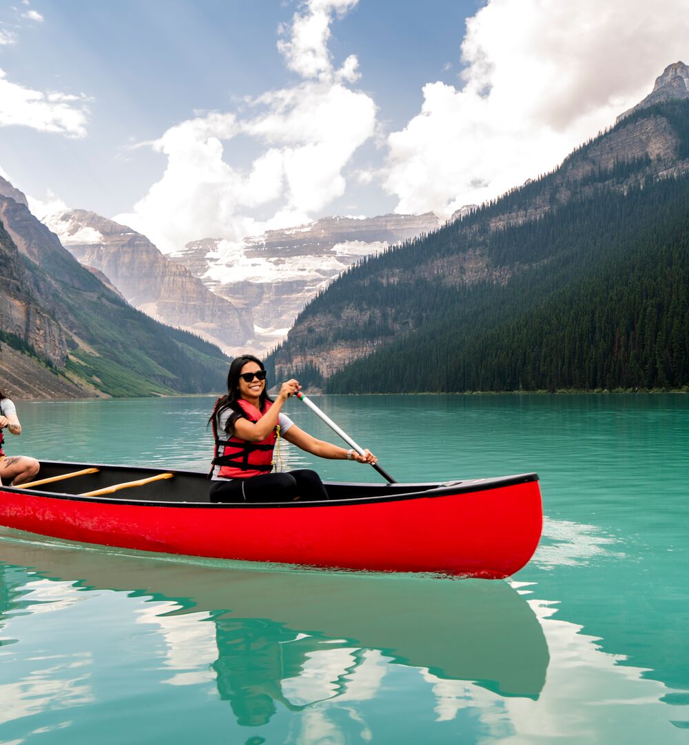 Two people canoeing on Lake Louise, one of the best things to do in June in Banff National Park