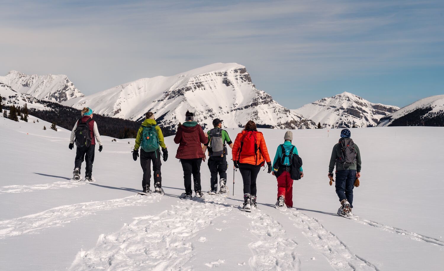 A group of people on a guided snowshoe tour in Banff National Park