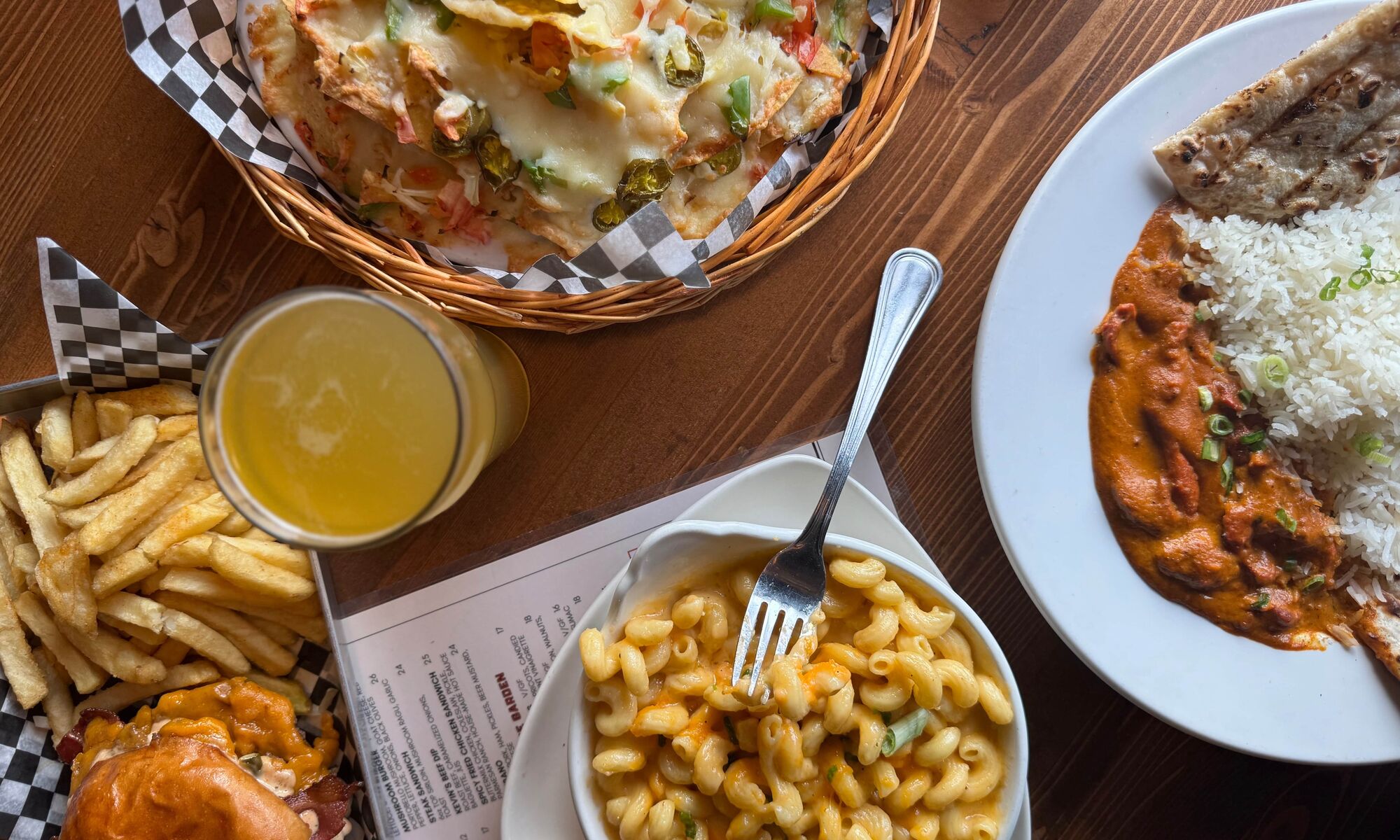 A table with four different plates of food from the Rose and Crown in Banff National Park