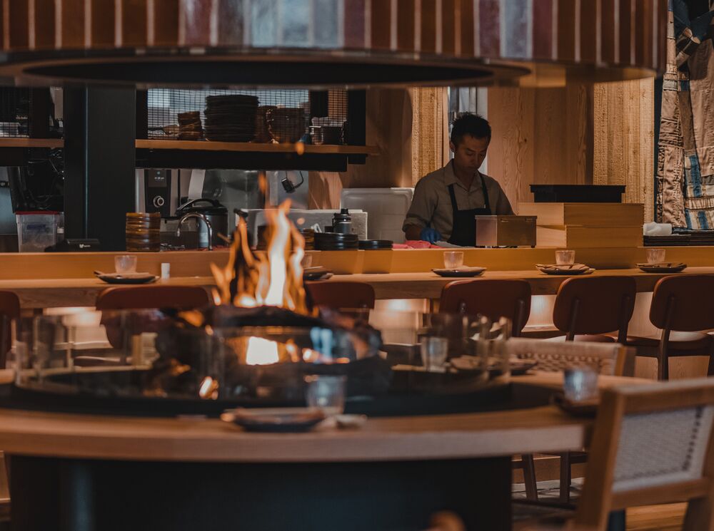 The interior of a restaurant with a fire place in Banff National Park