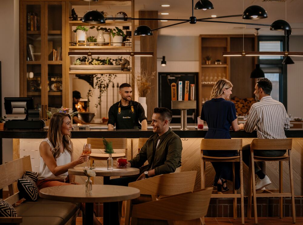 Two couples having a drink in a restaurant in Banff National Park