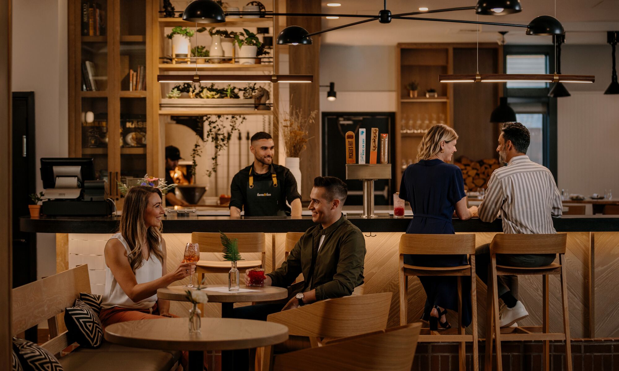 Two couples having a drink in a restaurant in Banff National Park