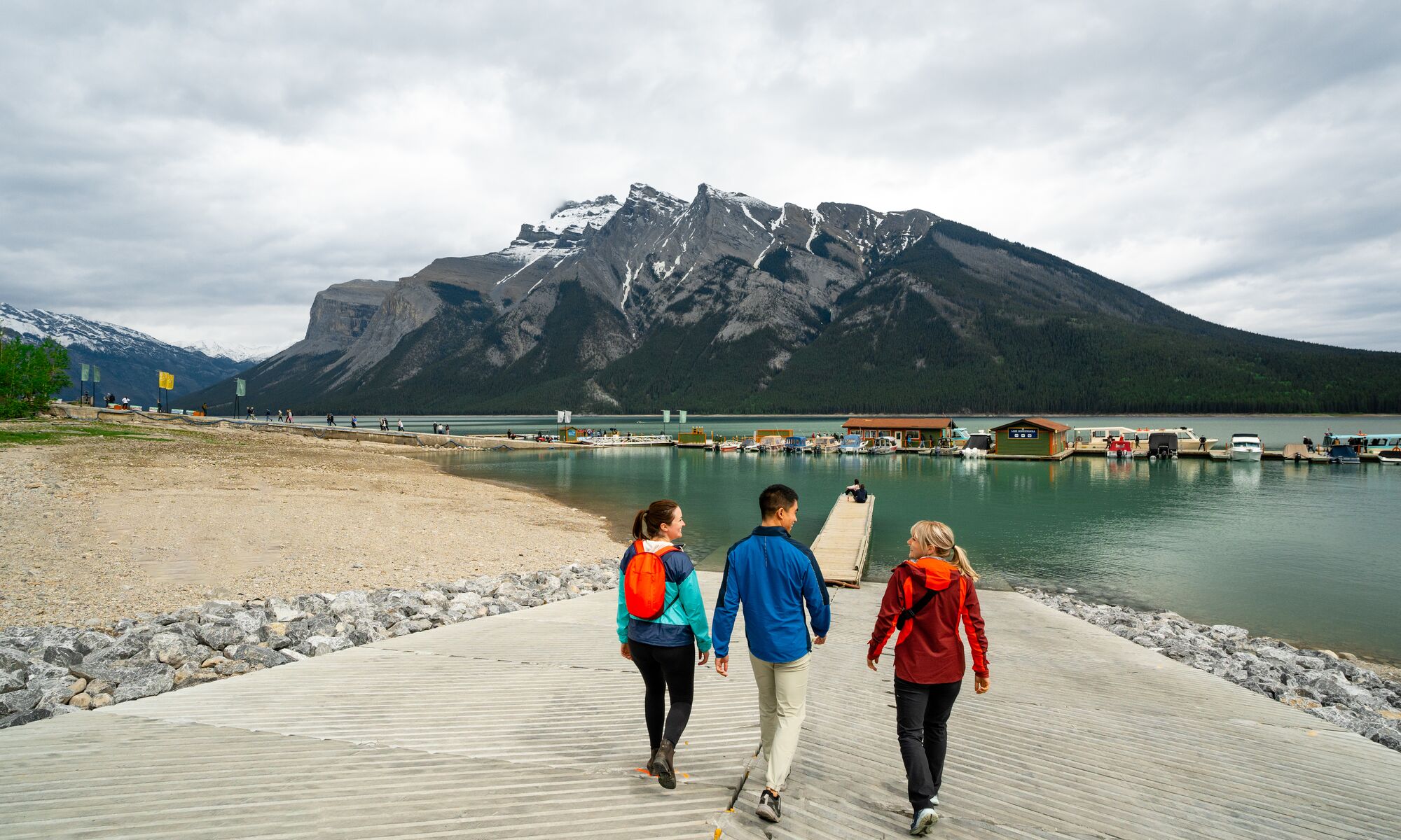 A group of friends walking down to Lake Minnewanka in Banff National Park