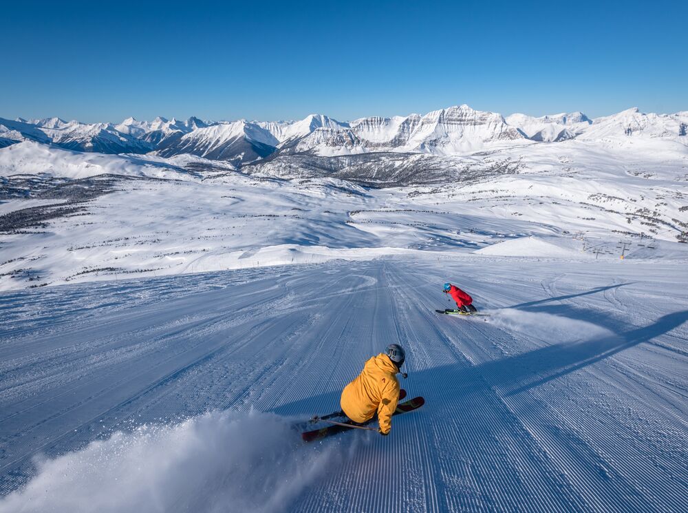 Two people skiing at Sunshine Village in Banff National Park