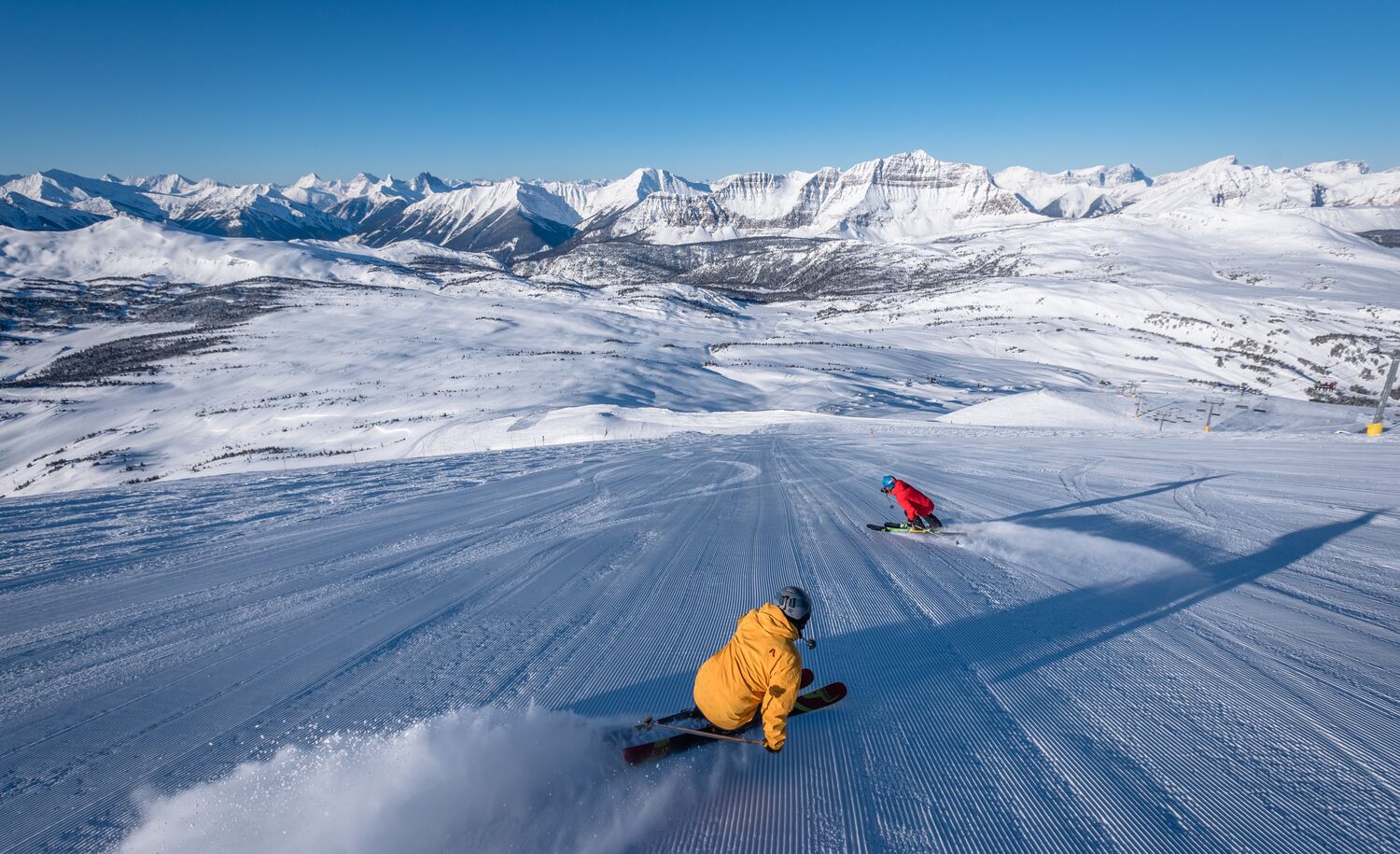 Two people skiing at Sunshine Village in Banff National Park