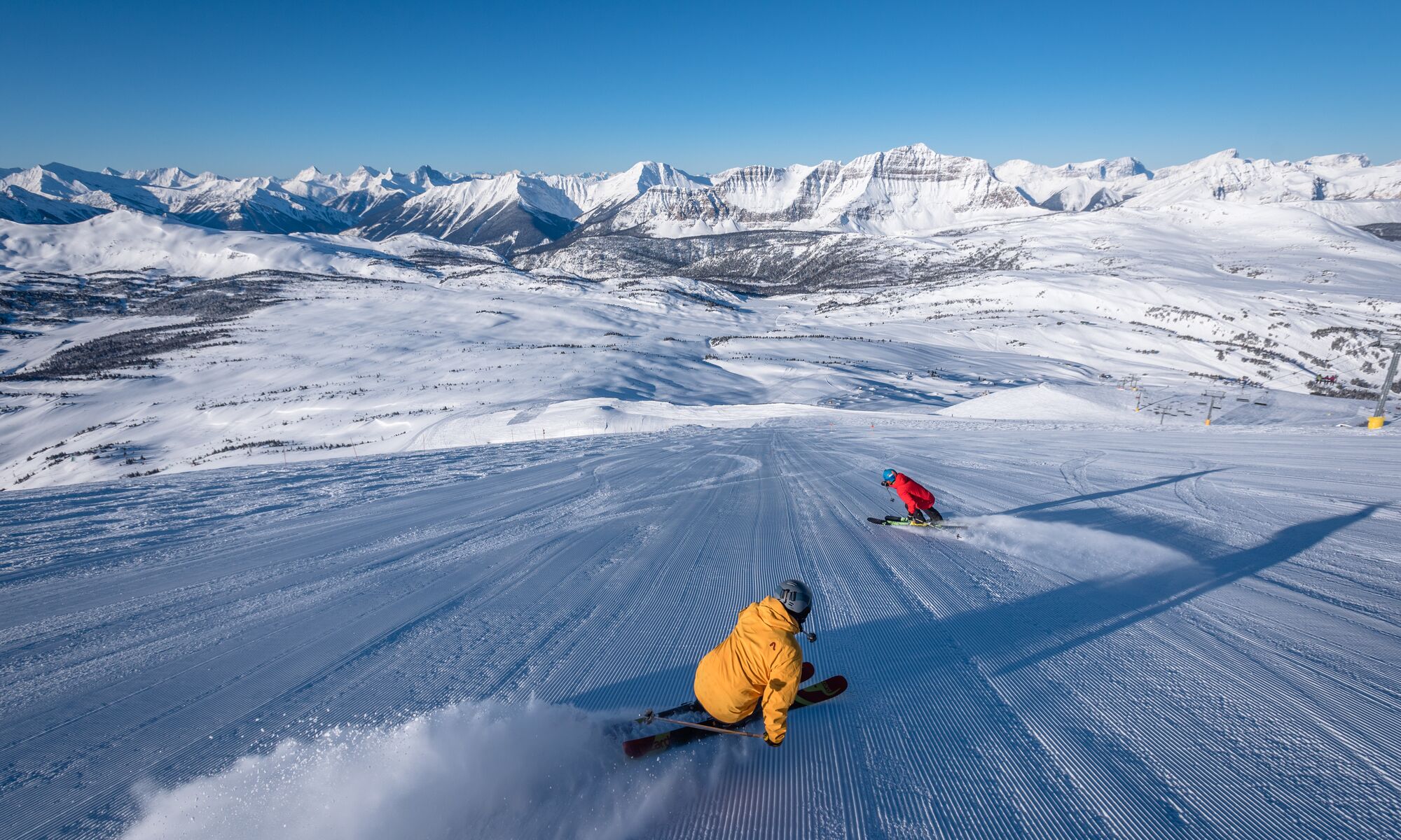 Two people skiing at Sunshine Village in Banff National Park