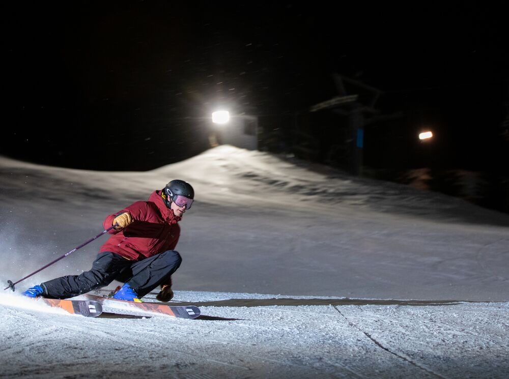 A person night skiing at Mount Norquay in Banff National Park