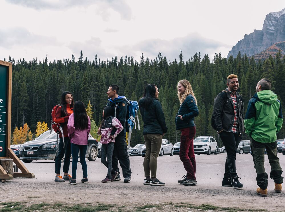 People waiting in line for a shuttle bus to Moraine Lake in Banff National Park