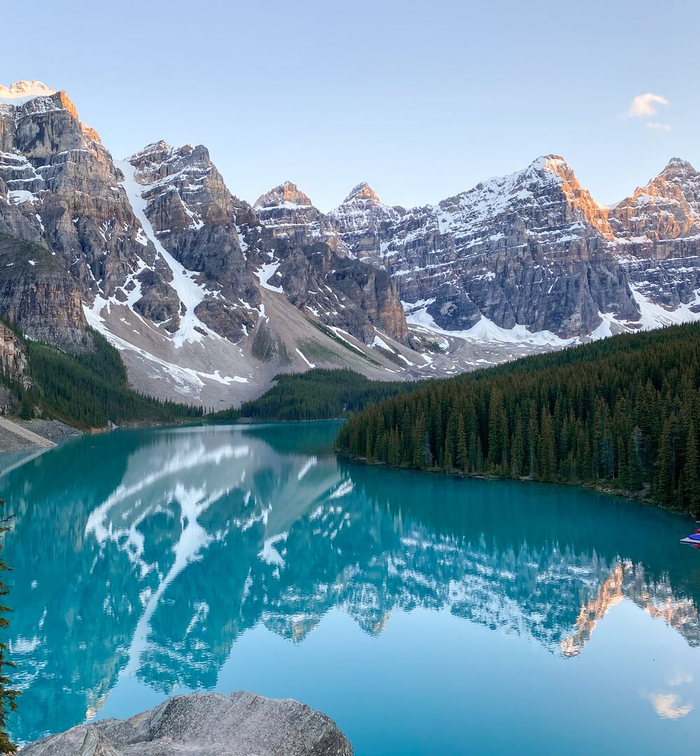 The view of Moraine Lake at sunset in Banff National Park from the Rockpile Trail, one of the best hikes in Moraine Lake.