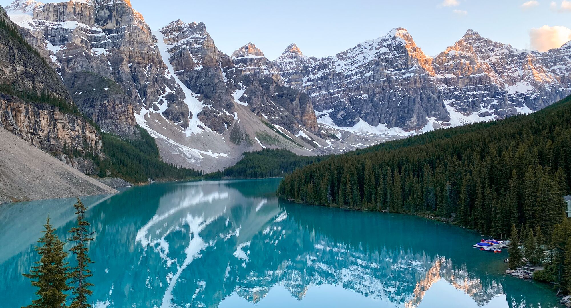 The view of Moraine Lake at sunset in Banff National Park from the Rockpile Trail, one of the best hikes in Moraine Lake.