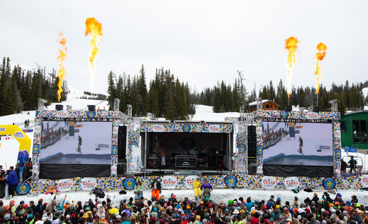 A stage at Sunshine Village for slush cup with lots of people in Banff National Park