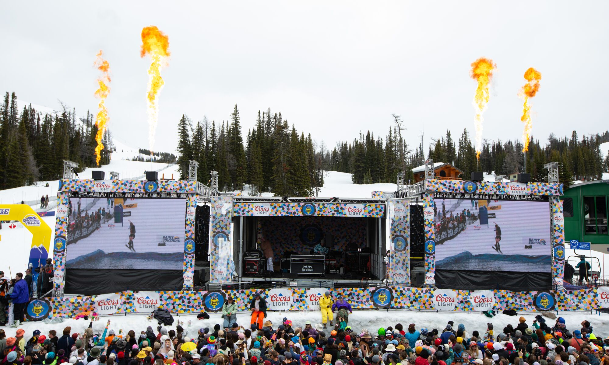 A stage at Sunshine Village for slush cup with lots of people in Banff National Park