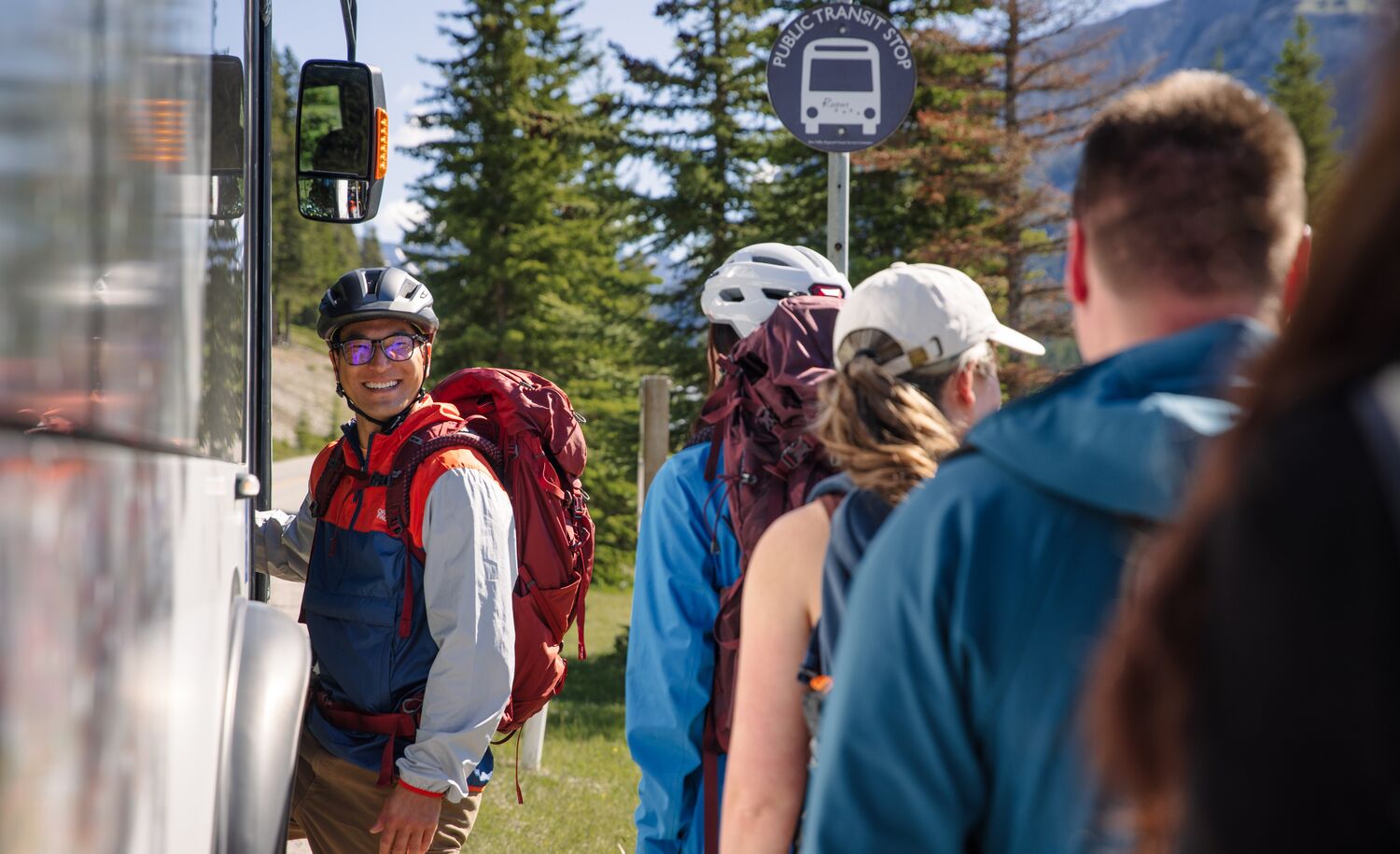 People lining up and getting on a bus in Banff National Park