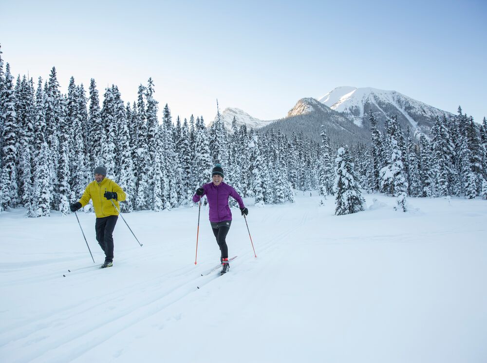 Two people cross country skiing in Lake Louise in Banff National Park