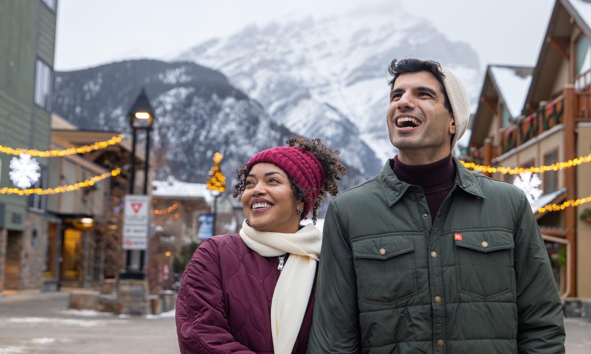 A couple walking down the street in winter in Banff National Park