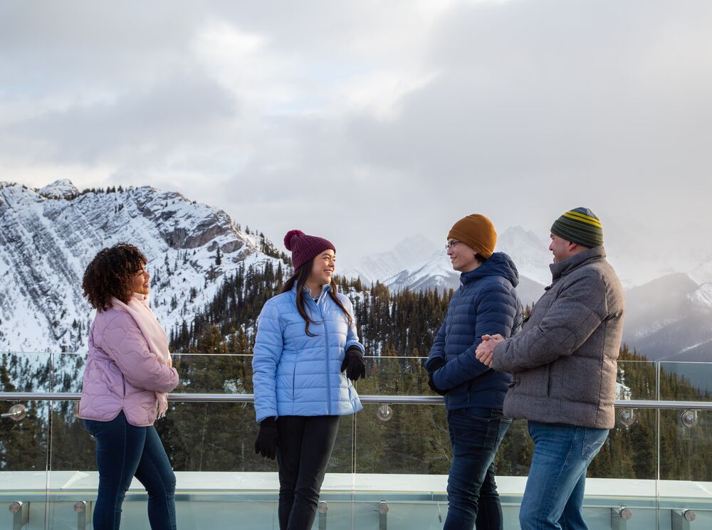 Four people on top of the Banff Gondola in Banff National Park