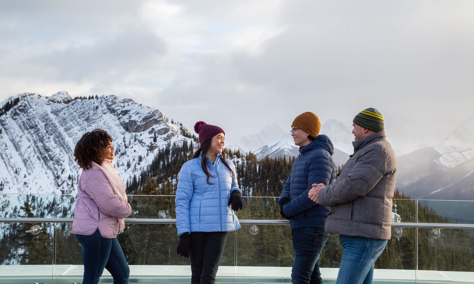 Four people on top of the Banff Gondola in Banff National Park
