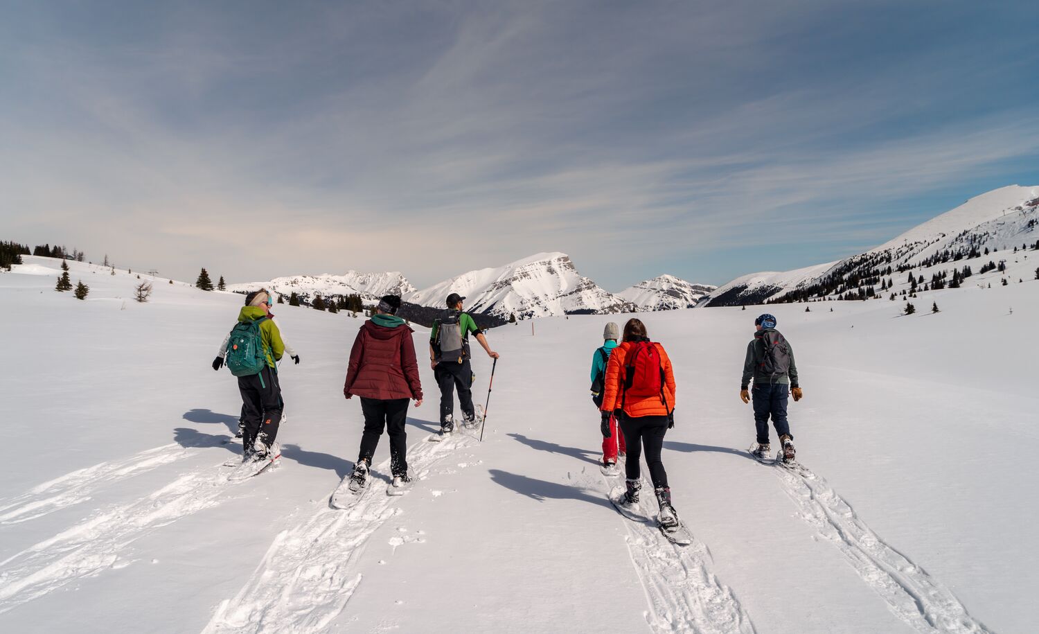 A group of people on a guided snowshoeing tour in Banff National Park