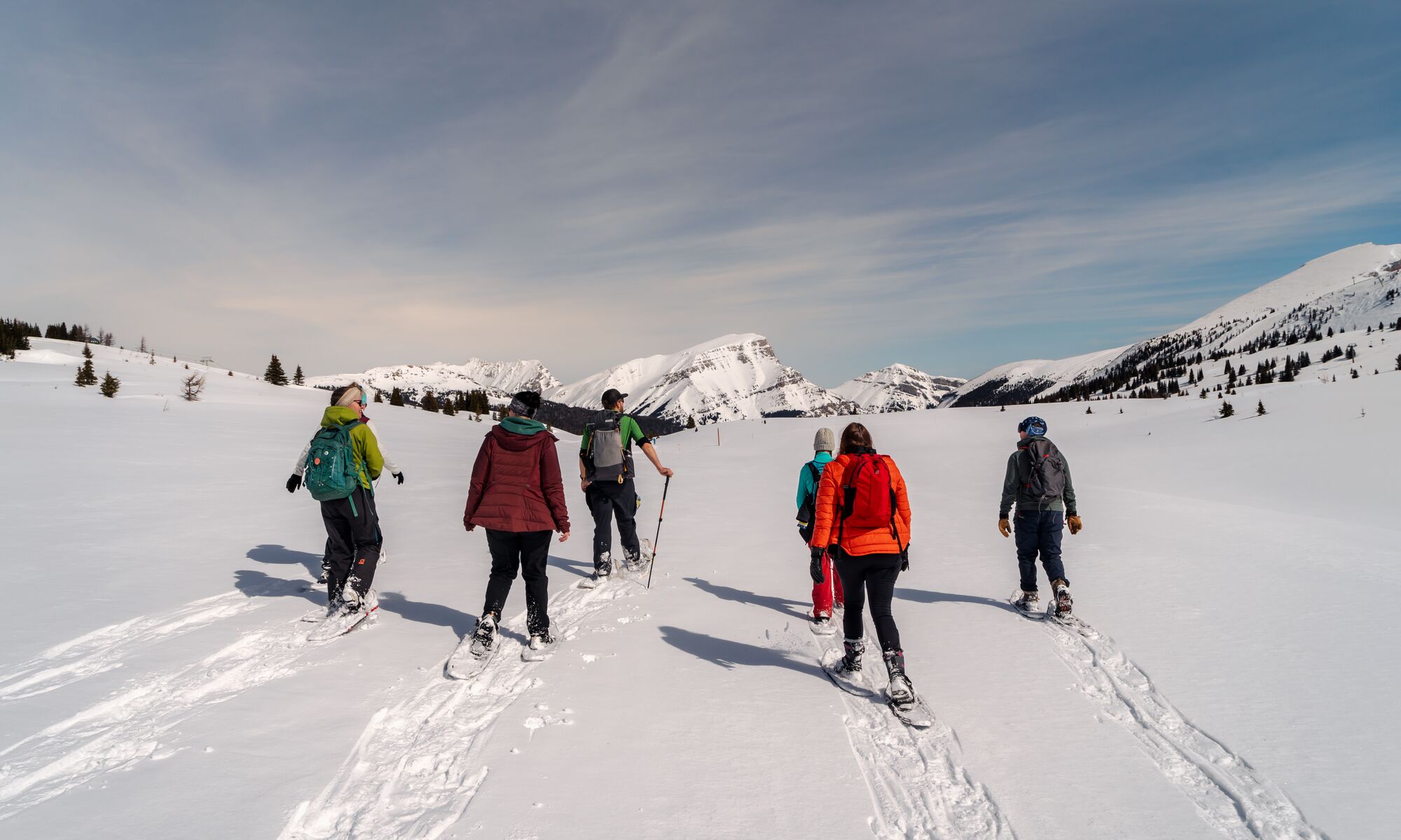 A group of people on a guided snowshoeing tour in Banff National Park