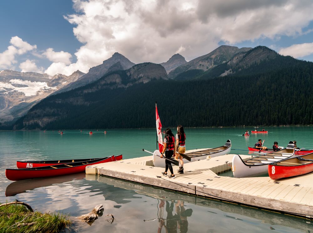 Two people on the Lake Louise canoe docks in Banff National Park