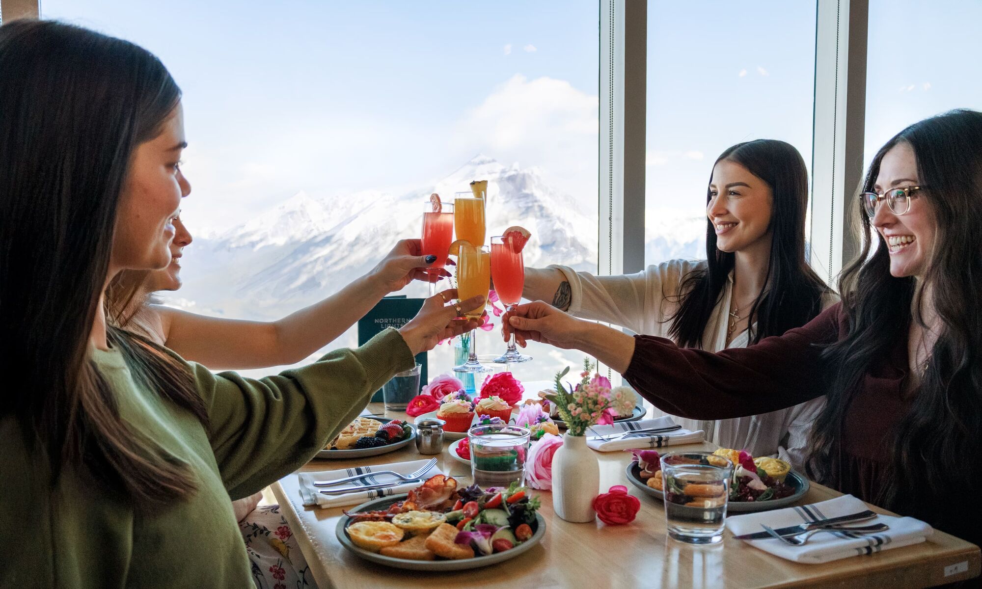 A group of friends at brunch at Sky Bistro in Banff National Park