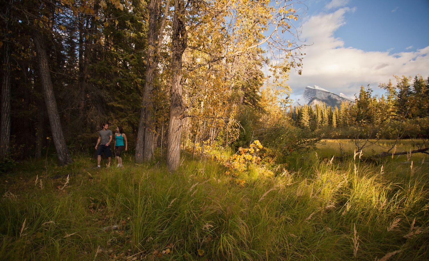 A couple walking in Banff National Park, a popular thing to do in Banff in September