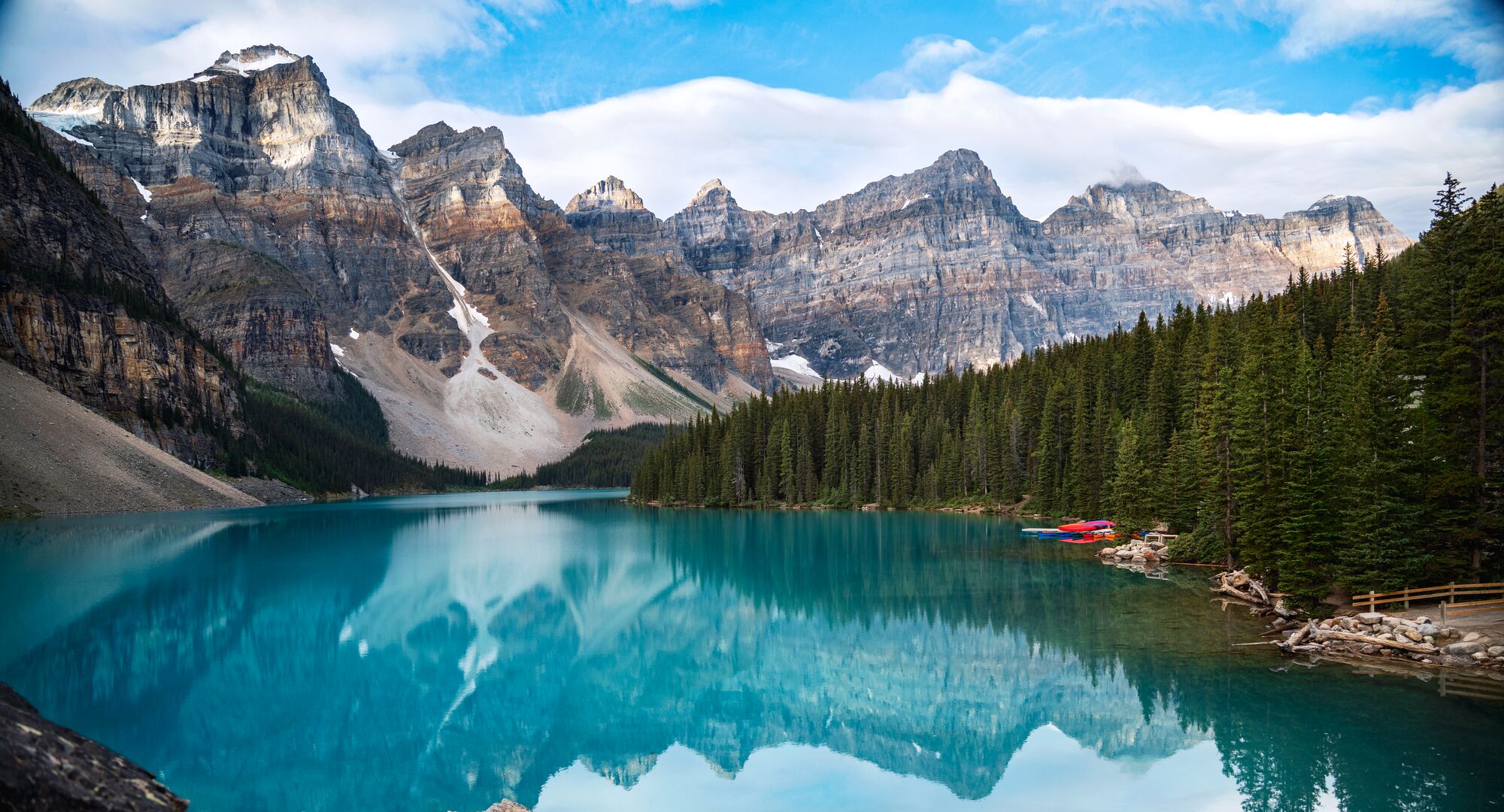 A bright blue Moraine Lake surrounded by mountains in Banff National Park