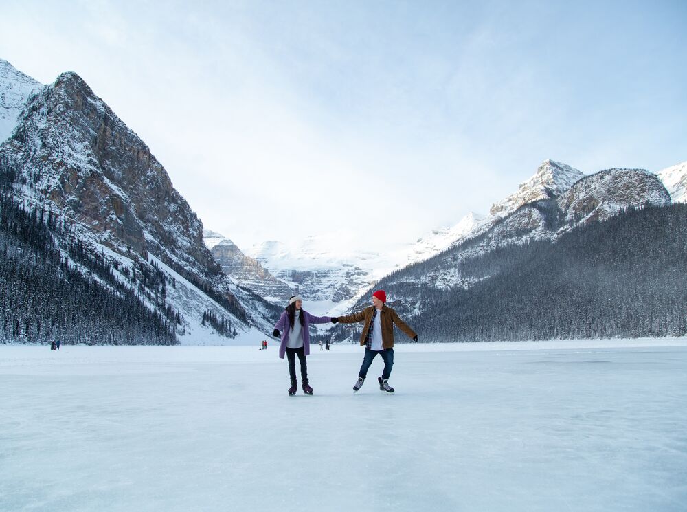 A couple skating on Lake Louise in Banff National Park