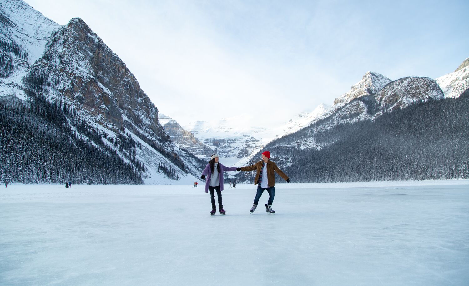 A couple skating on Lake Louise in Banff National Park