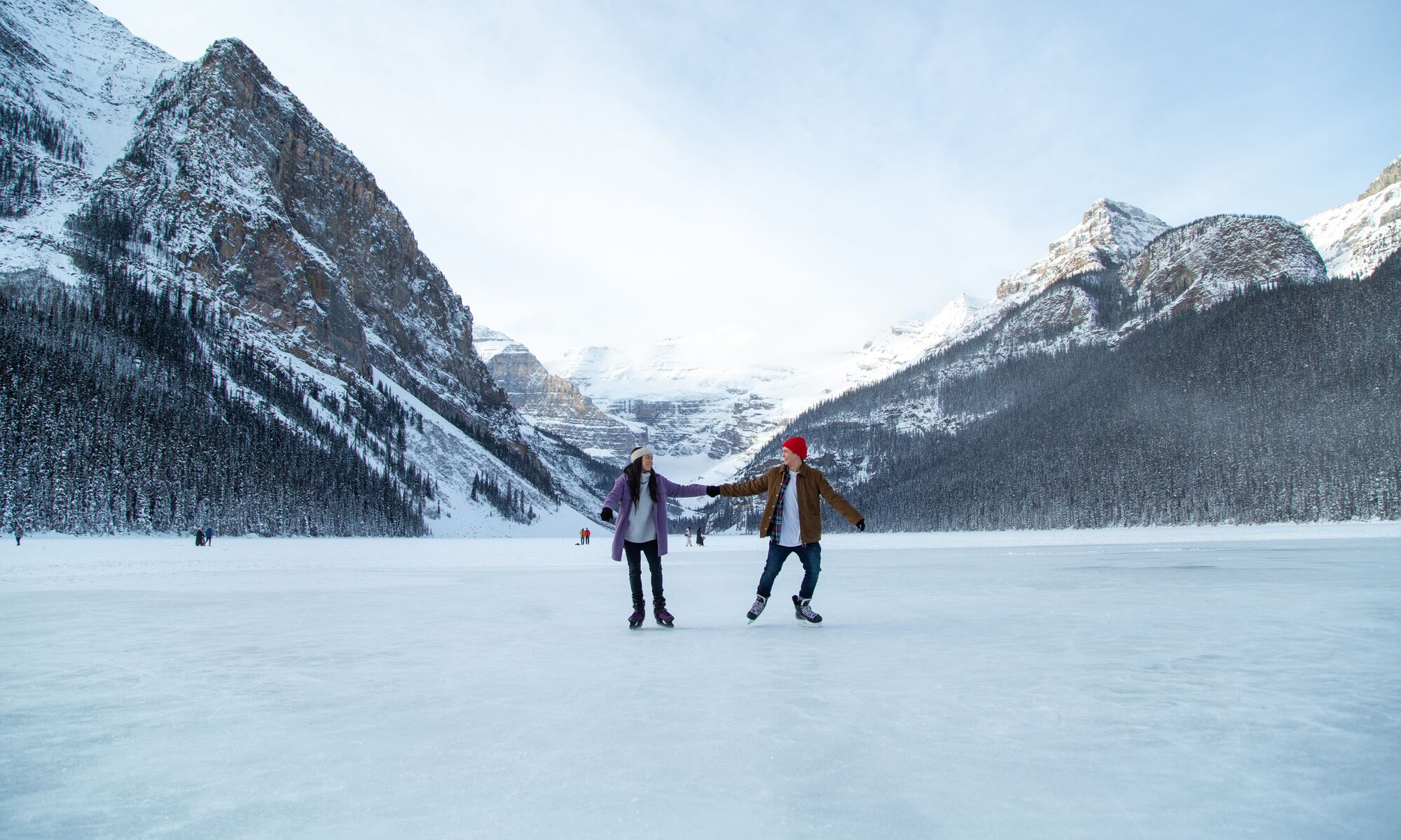 A couple skating on Lake Louise in Banff National Park