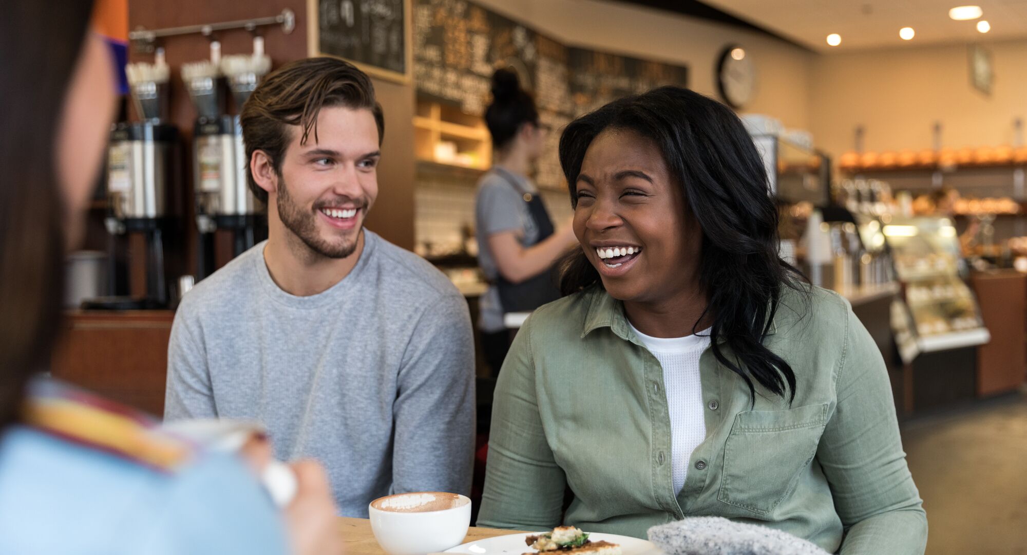 Friends enjoying pastries and coffee at Wild Flour Bakery in Banff.