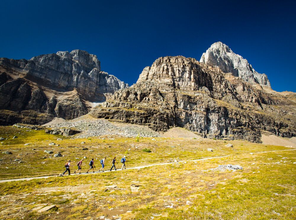 A group of people on a guided hike at Moraine Lake in Banff National Park