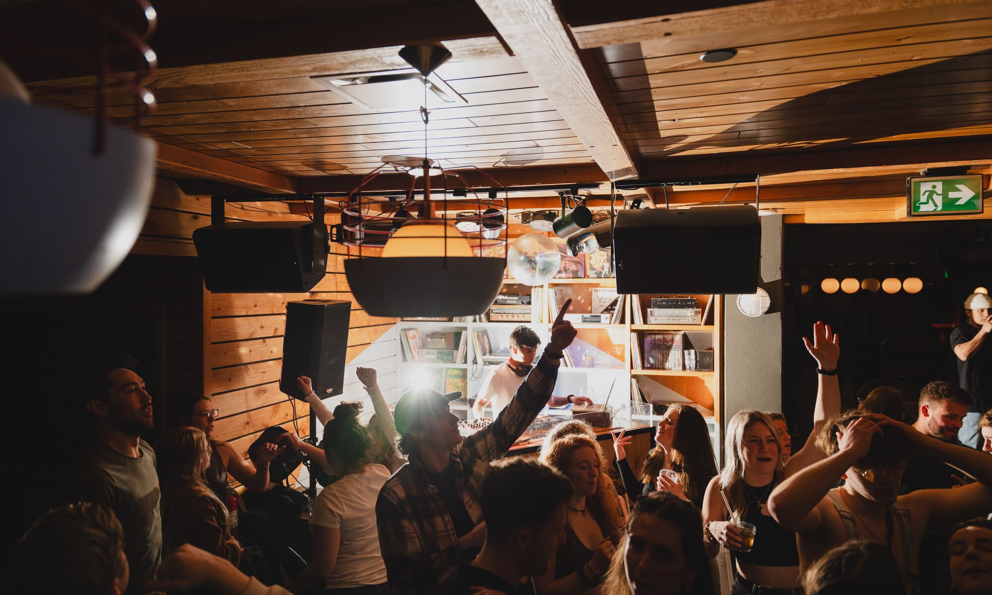 A group of people dancing at a bar in Banff National Park
