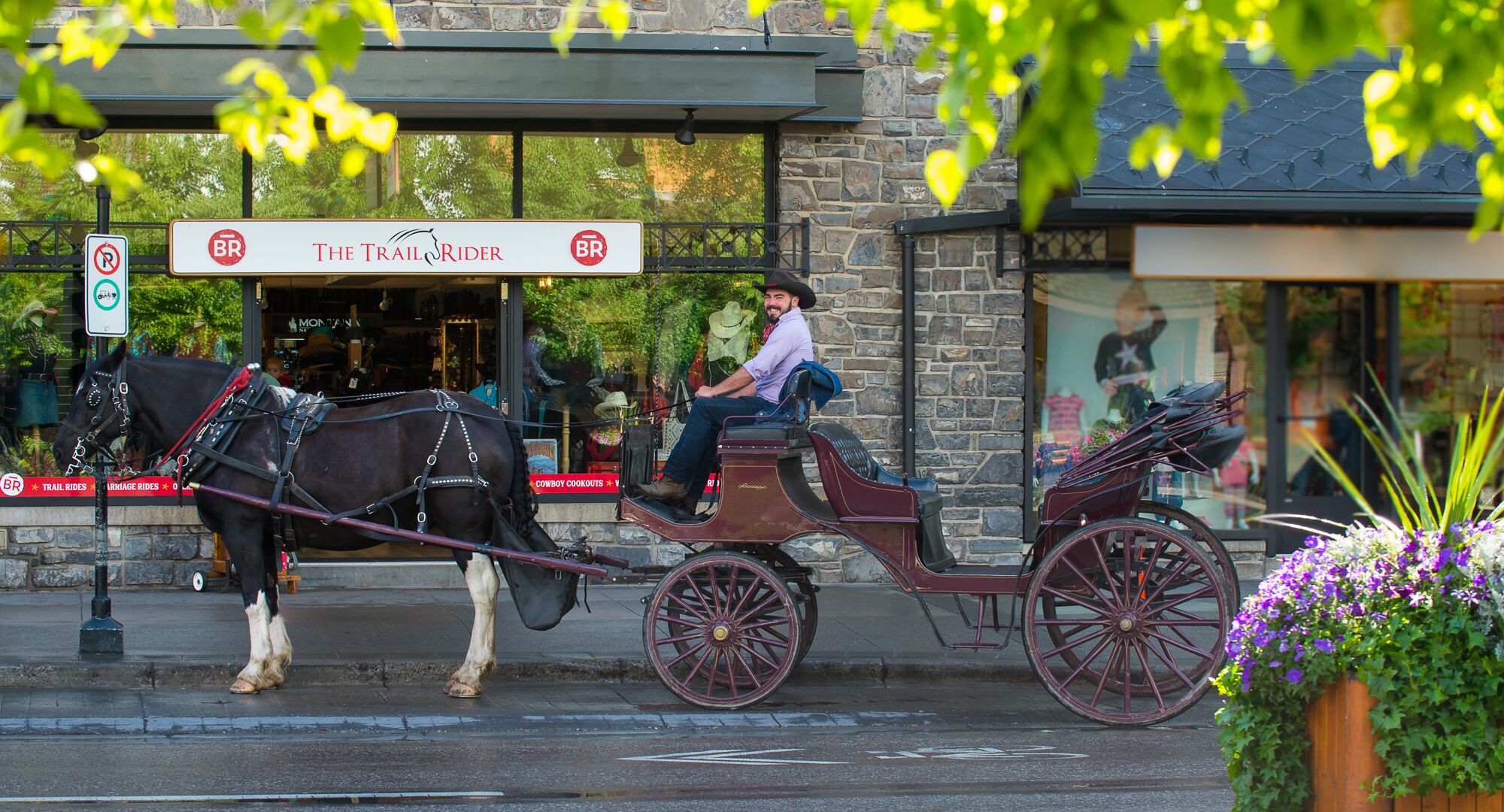 A horse wagon sitting in front of The Trail Rider store on Banff Avenue.