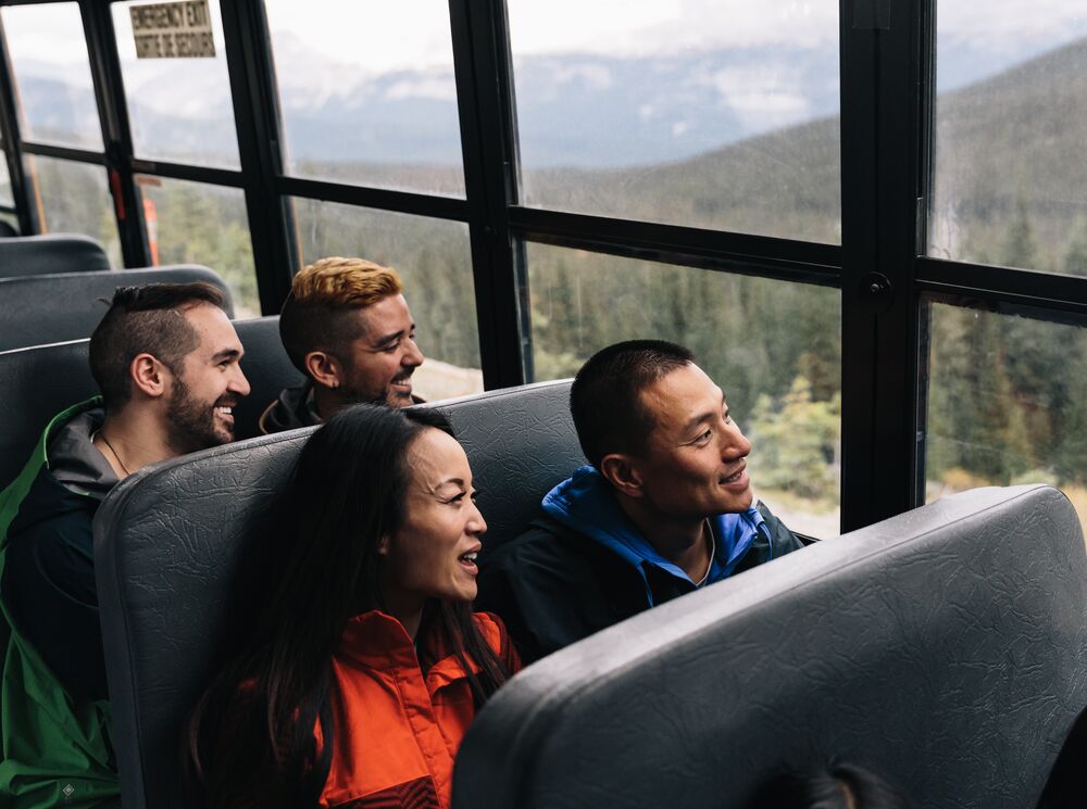 Four people on a bus in Banff National Park