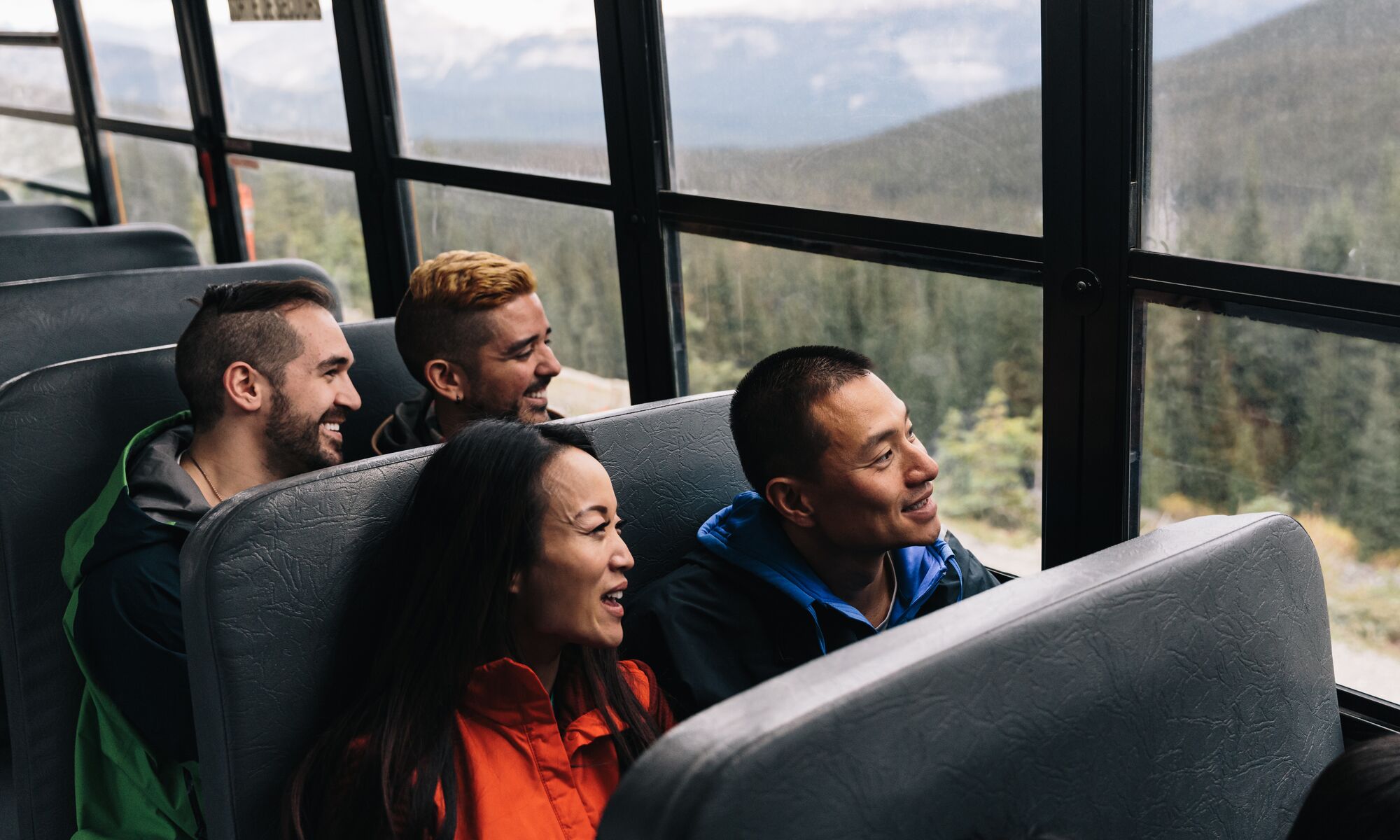 Four people on a bus in Banff National Park