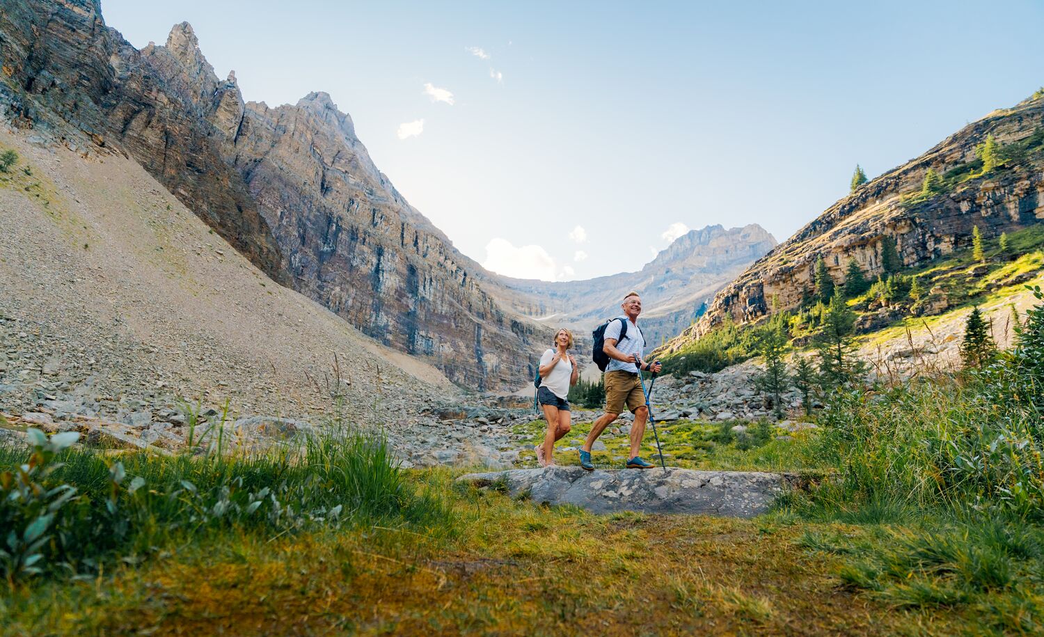 Two people walk near the switchbacks up Big Beehive, a hike in Lake Louise in Banff National Park.