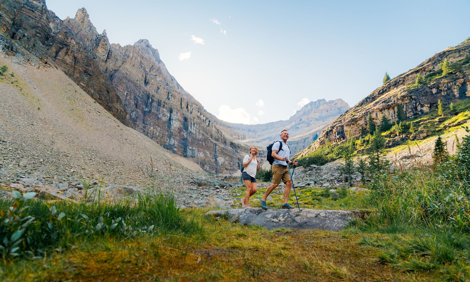 Two people walk near the switchbacks up Big Beehive, a hike in Lake Louise in Banff National Park.