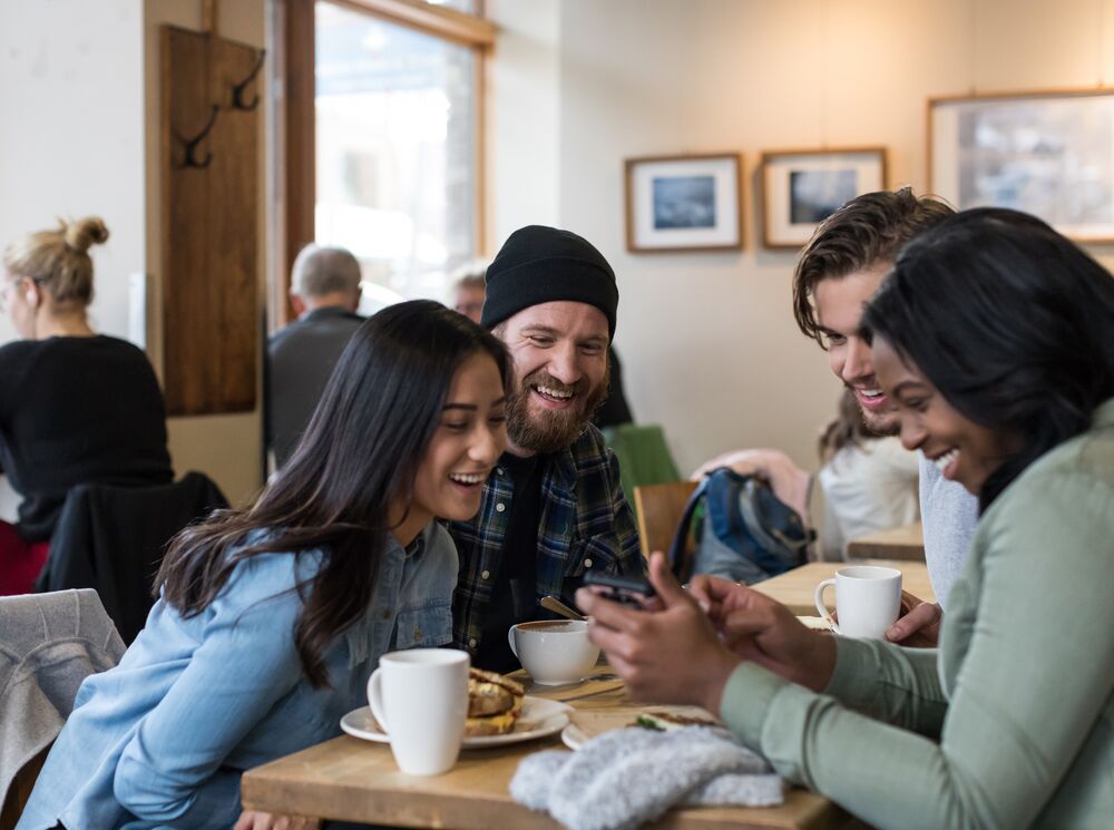 Friends enjoy a conversation at Wild Flour in Banff National Park.