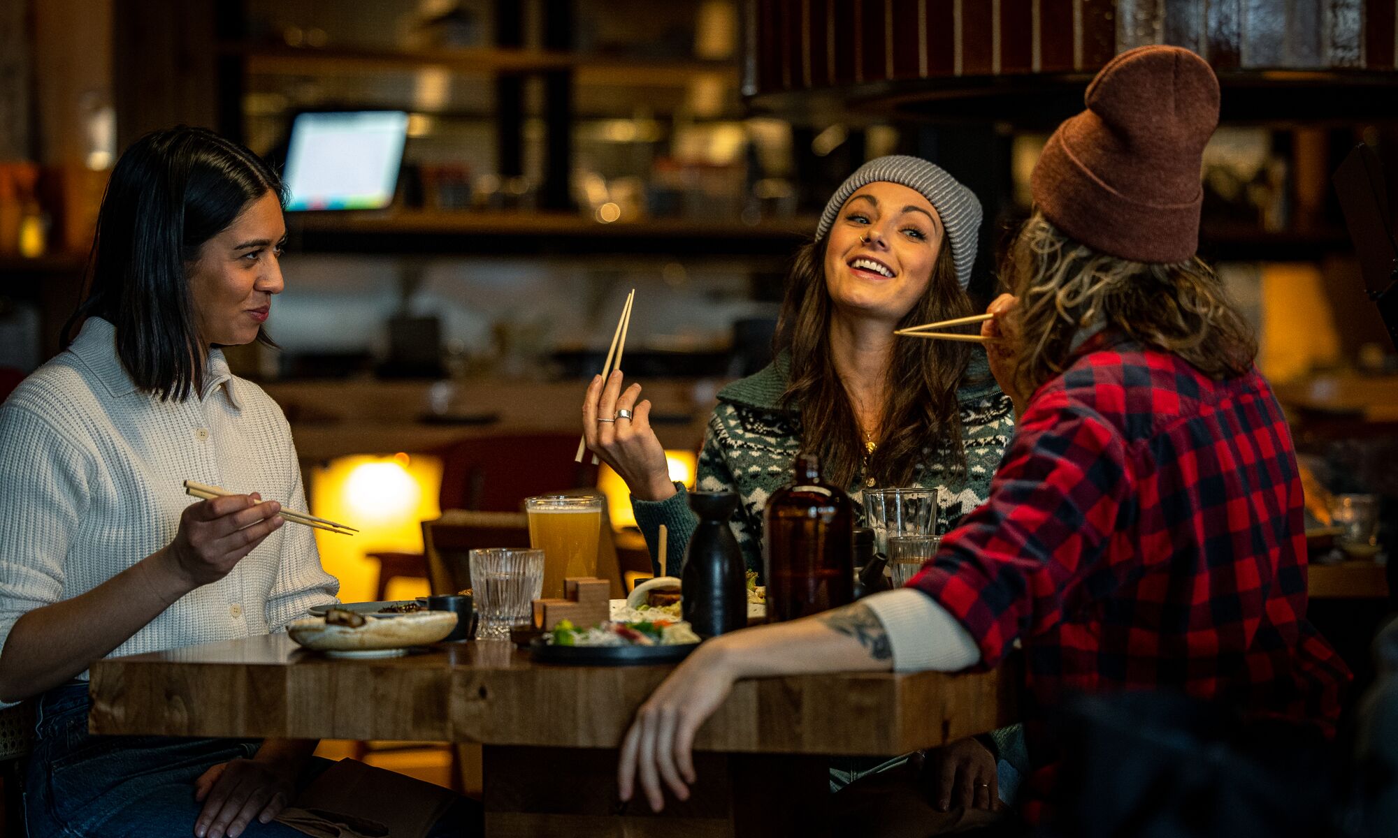 Three people eat at Hello Sunshine in Banff National Park.
