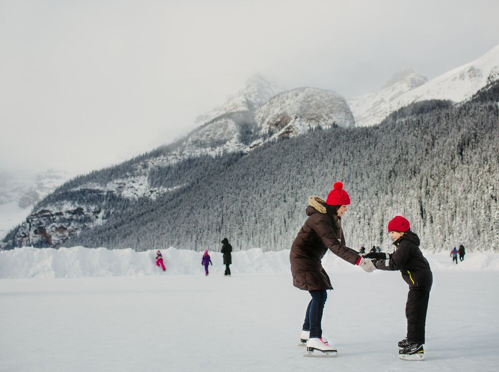 A family skating on Lake Louise in Banff National Park
