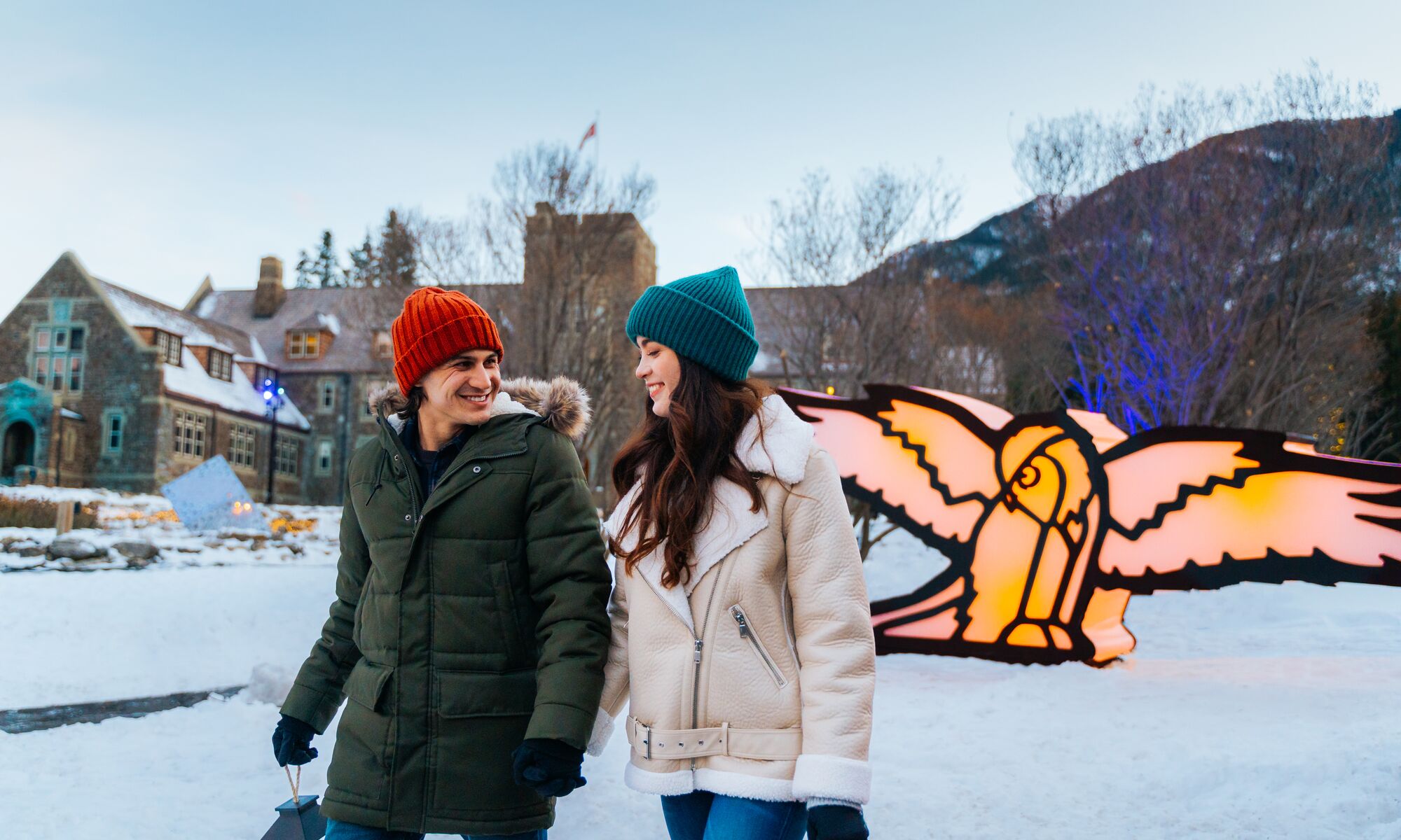 A couple walking through In Search of Christmas Spirit in Banff National Park 
