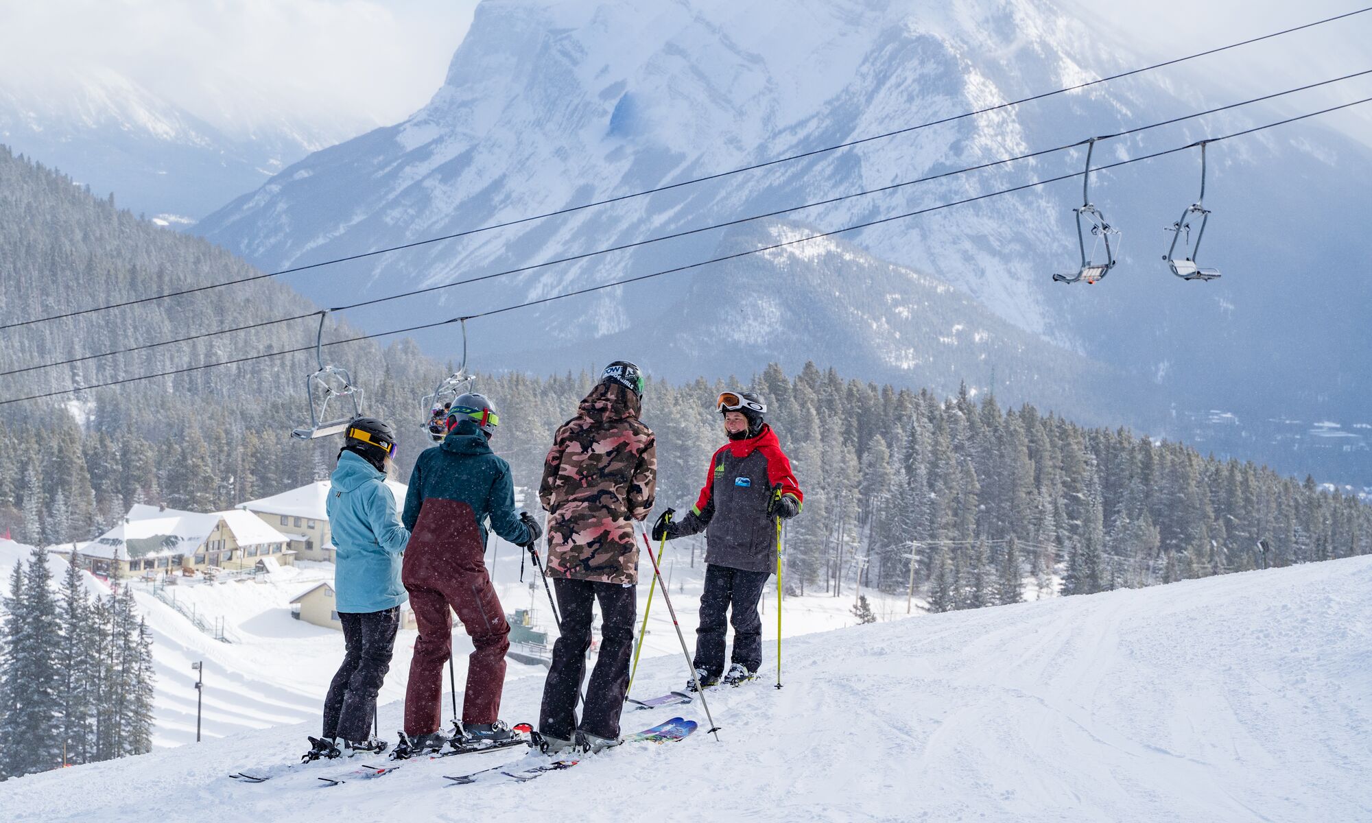 Three people taking a ski lesson at Mount Norquay in Banff National Park