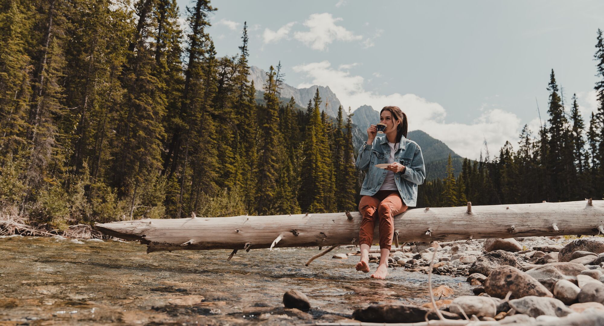 Outdoor Hot Tub on a balcony with winter mountains in the background.