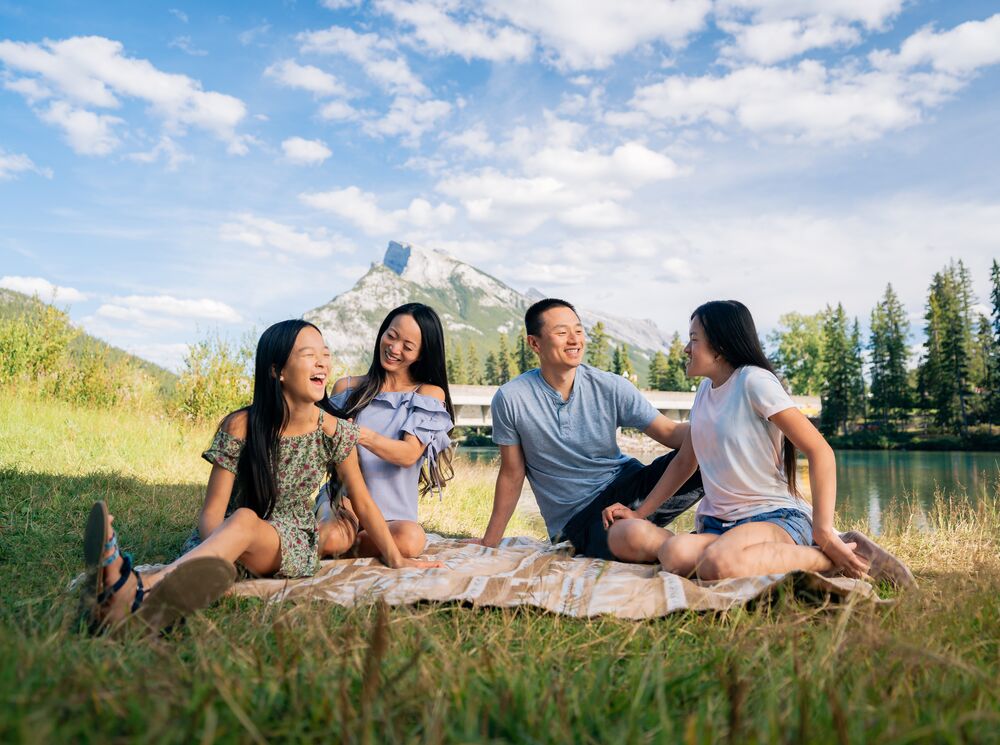 A family of four having a picnic in Banff National Park
