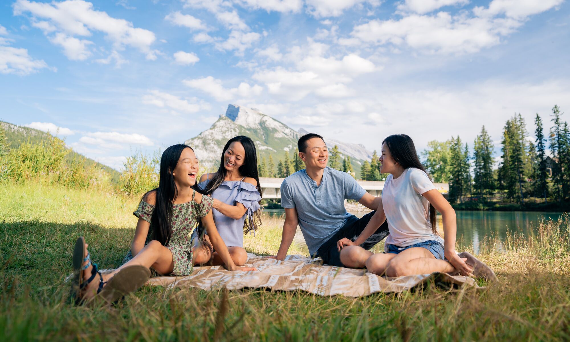 A family of four having a picnic in Banff National Park